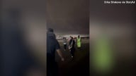 300 Delta passengers left stranded on tarmac overnight after storms divert planes to airport without customs