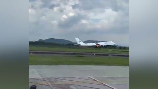 Boeing 747-400 catches fire, forced to land in Indonesia - Fox Business Video