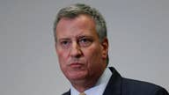 NYC Mayor Bill de Blasio skips NYPD swearing-in ceremony to join protests