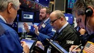 Markets end lower awaiting Senate tax reform vote
