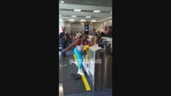 Woman in Miami airport throws computer at American Airlines worker