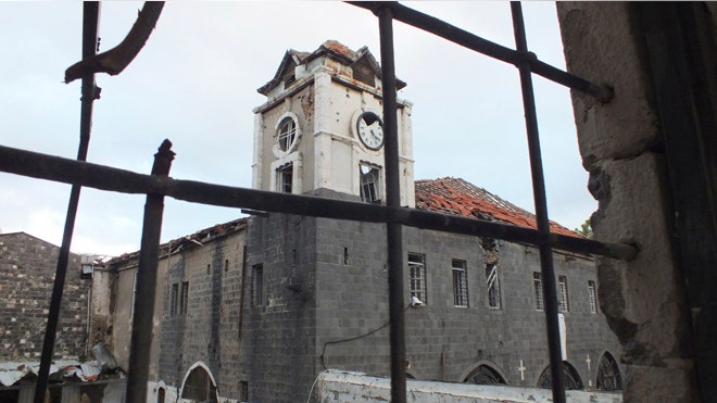An old damaged Orthodox Church is pictured in the besieged area of Homs. (Reuters)