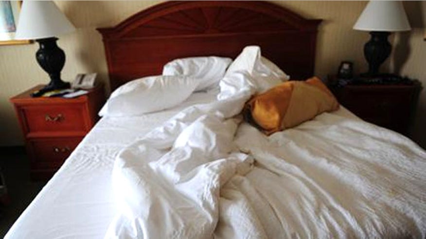 hotelroom_istock_bed.jpg
