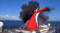 Cruise ship seen on fire at Grand Turk dock