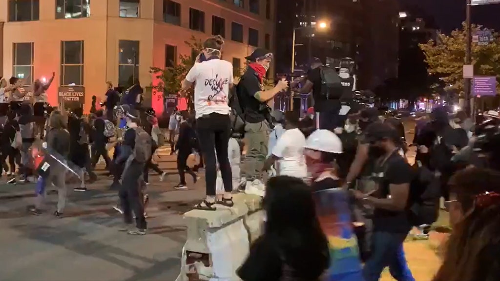 SEE IT: DC protesters shine lights into homes, set off fireworks