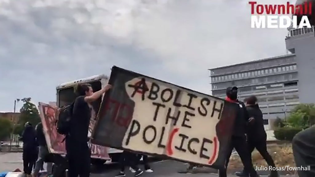 Louisville protesters grab signs, shields other supplies from U-Haul truck