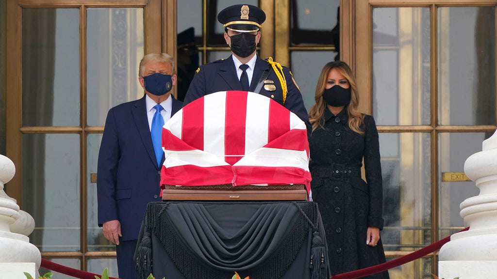 Protesters boo Trump and First Lady as they pay respect to Justice Ginsburg