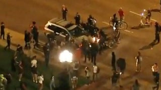 Denver police detain driver after vehicle plows into protesters: 'He wasn&rsquo;t gonna stop even though I was, like, on his hood'