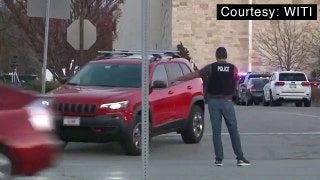 Mall shooting - Cop and red car