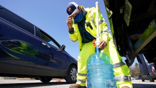 Man filling water jug