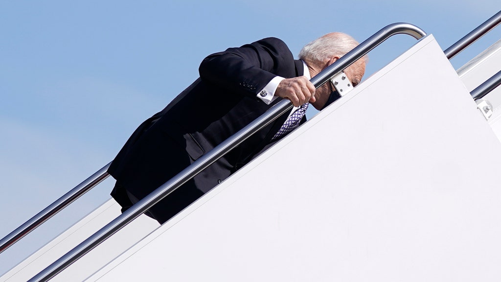 Biden stumbles multiple times, falls as he climbs Air Force One stairs