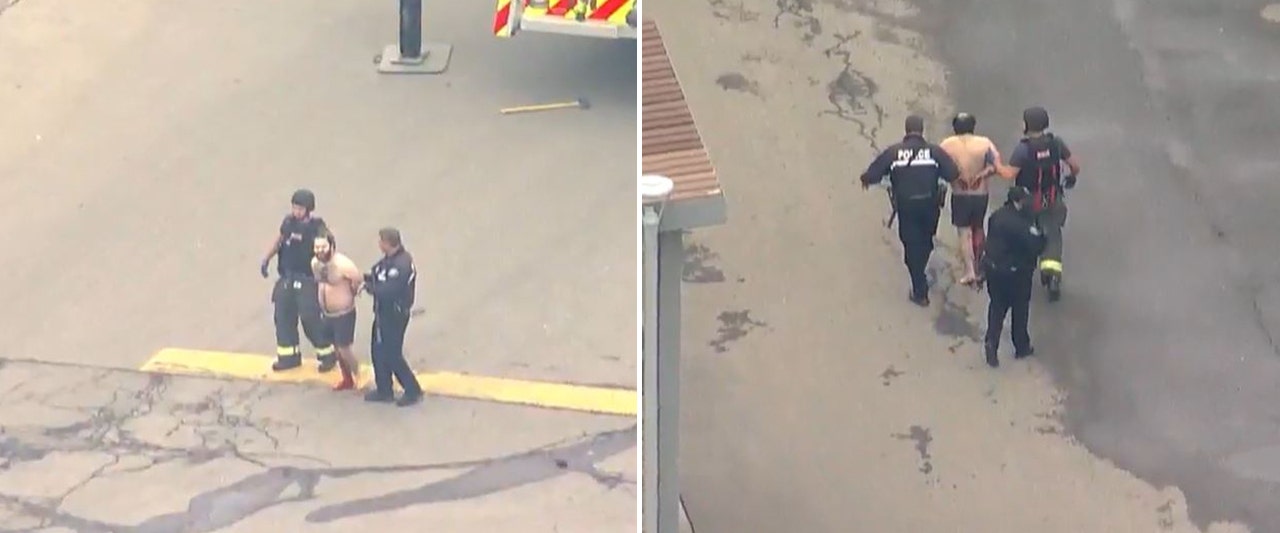 Police descend on 'active shooter' scene, led away handcuffed, bloody shirtless man