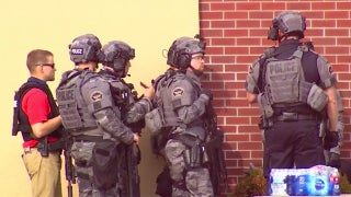 Minnesota hostage situation follows bank-robbery attempt; some captives freed, report says