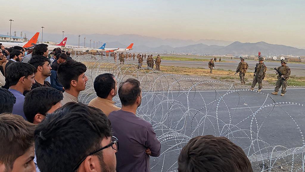 3 killed by gunfire in Kabul airport as thousands try to flee Taliban