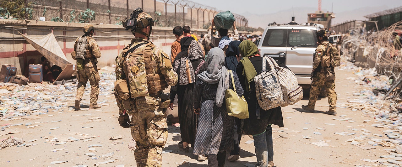 Soldier, women with bags