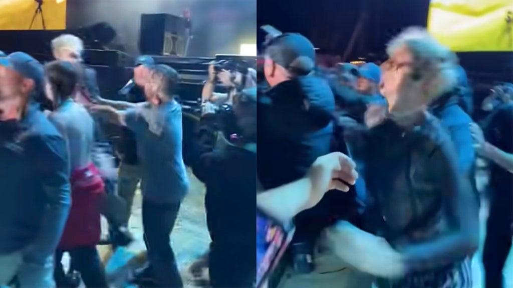 Rapper Machine Gun Kelly takes swing at fan who shoved him at rowdy festival