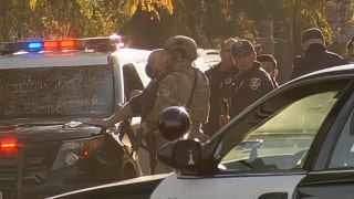 Armed man barricades himself inside California building, shoots police officer