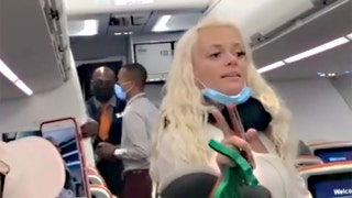 Couple in viral video kicked off JetBlue flight over refusal to wear masks, berating staff, airline says