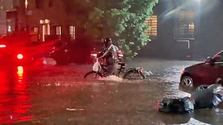 Hero NYC delivery man kept pushing through floodwater, video shows