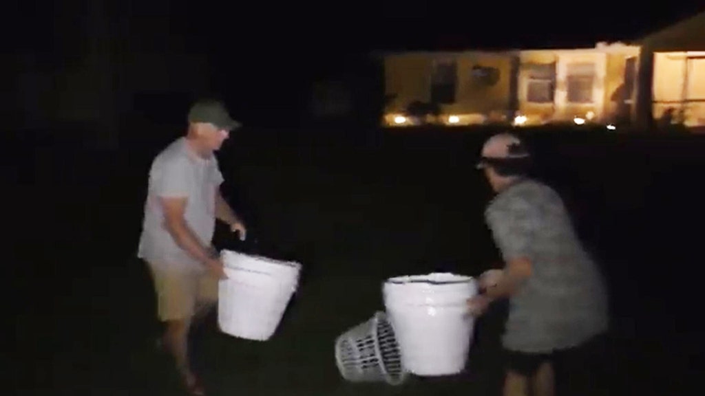 Laundrie’s parents remove laundry baskets, poster left by protesters