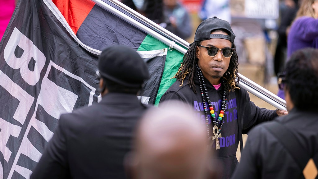 man with BLM flag