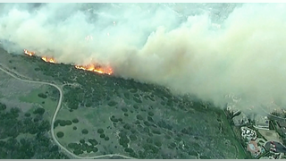 BEACH BLAZE: Firefighters launch air assault to battle raging California wildfire