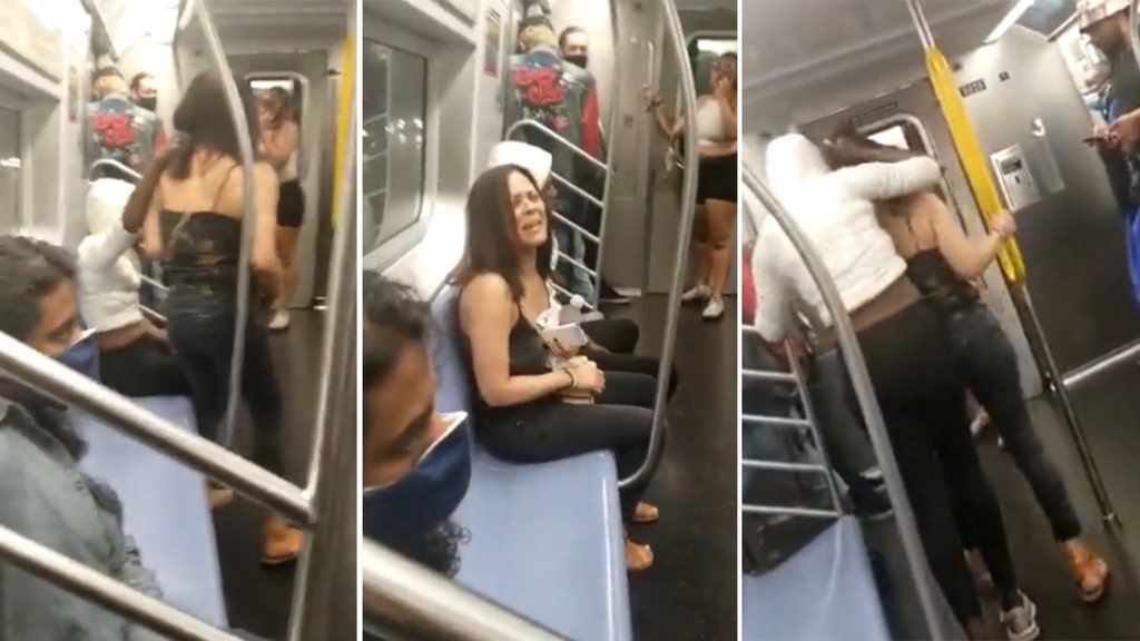 Video shows individual holding woman on train as passengers watch in horror