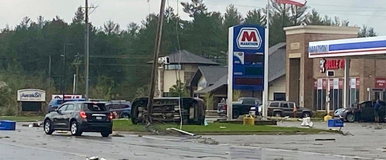 Dozens injured and at least 1 dead as rare tornado shreds buildings and flips cars in northern Michigan
