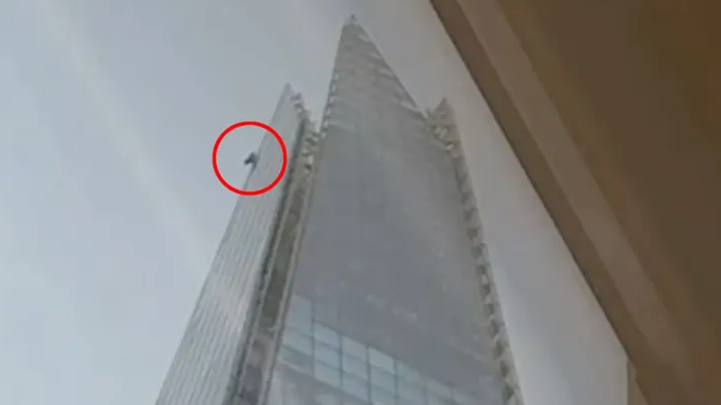 SEE IT: Police step in after man climbs 1,000-foot building