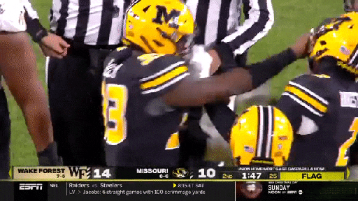 Football game comes to blows after player tries to help opposing QB
