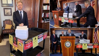 Sen. Rand Paul mocks massive $1.7 trillion spending bill with photo showing off all 4,155 pages