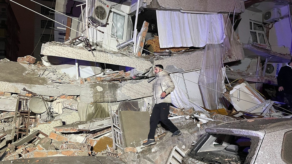 walking by crumbled bldg