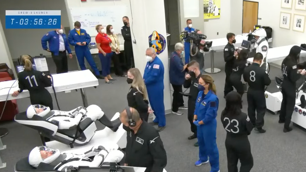 Astronauts get their spacesuits on