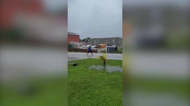 O say, can you see: Florida man waves American flag through winds of Ian