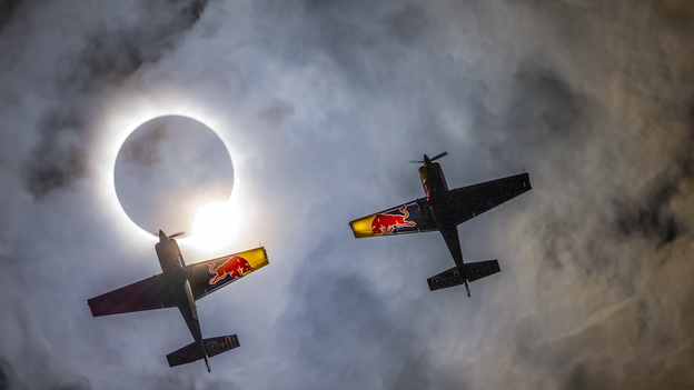 Red Bull aerobatic pilots fly under total solar eclipse