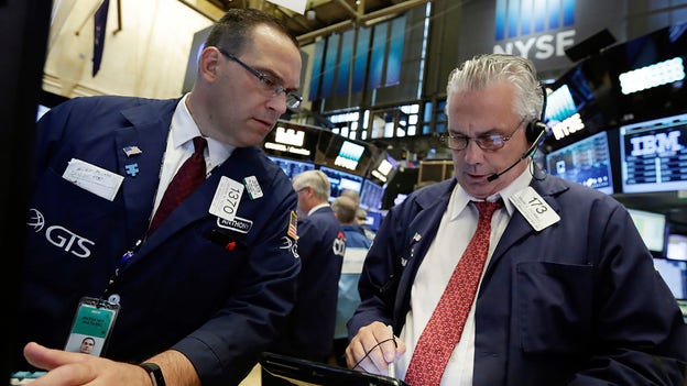 Stock futures trade cautiously the day after Fed hike
