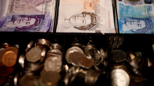 British pound gives back gains from U.K. tax cut reversal