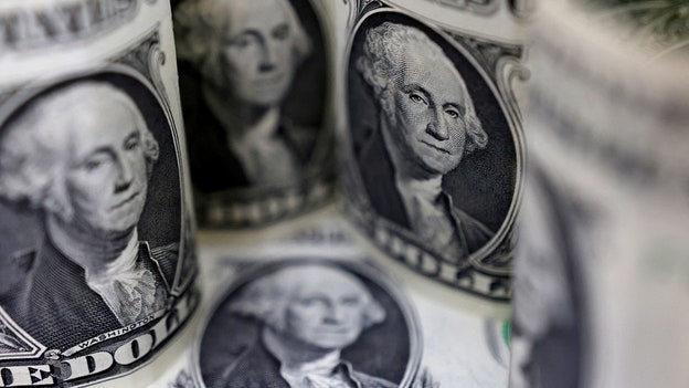 Dollar pares gains on falling US labor costs, before Fed decision