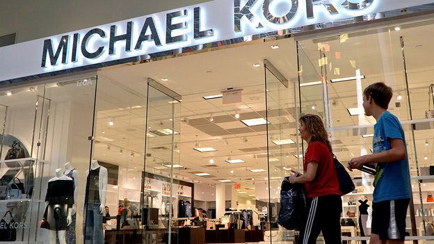 Michael Kors, Versace owner Capri cuts forecasts as demand slows