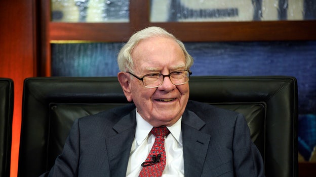 Warren Buffett's firm ups stakes in Japanese trading houses