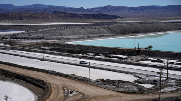 Threatened by shortages, electric car makers race for supplies of lithium for batteries