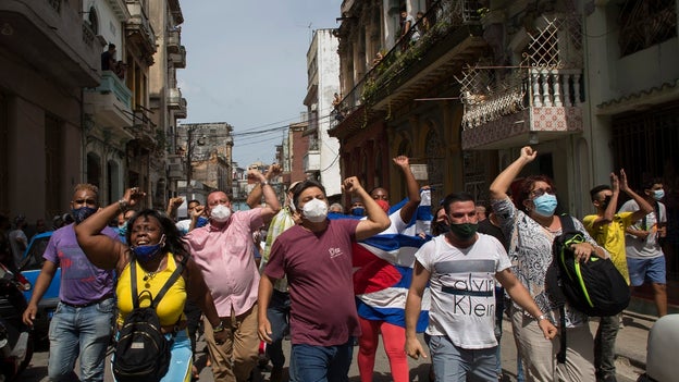 Cuban regime supporters seen brandishing large clubs as protest crackdown continues
