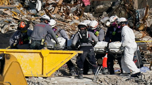 Surfside rescuers remove human remains from site