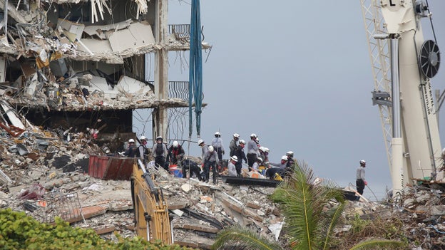 Rescue efforts reportedly halted over fears of remaining structure collapsing