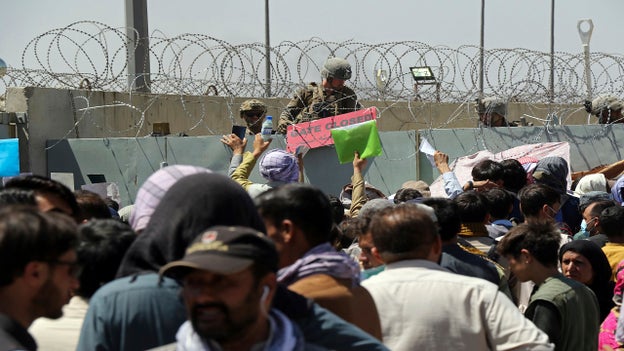 Photo shows Kabul airport gate being closed