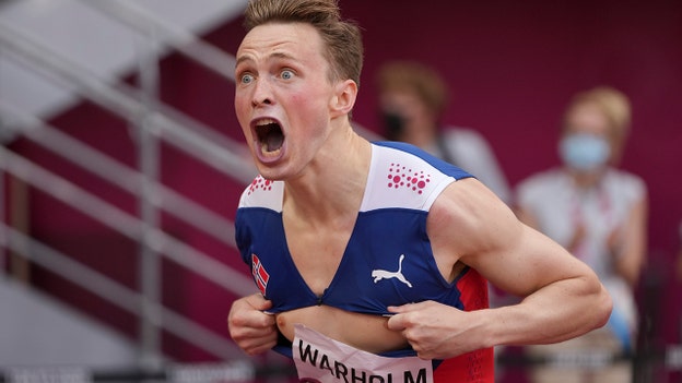 Norway Olympian Karsten Warholm breaks his own 400-meter hurdles world record