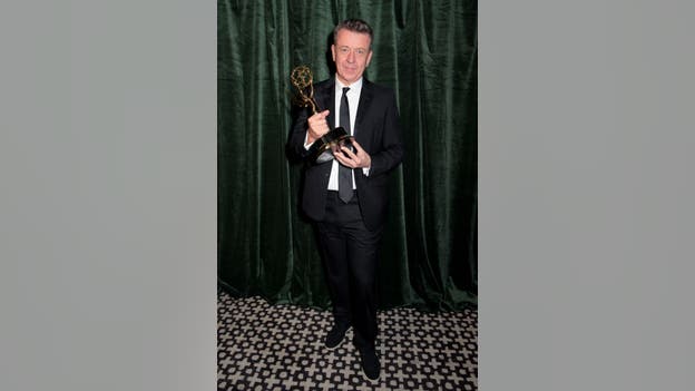 Peter Morgan wins award for outstanding writing for a drama series