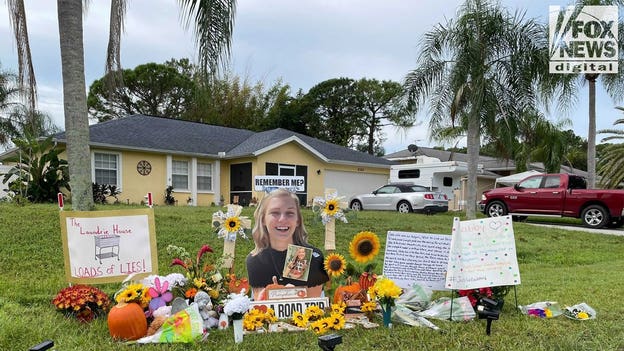 Woman removes signs critical of Brian Laundrie's parents from lawn; Gabby Petito memorial remains