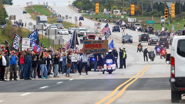 Biden faces hostile Michigan protesters as he arrives to promote stalling agenda