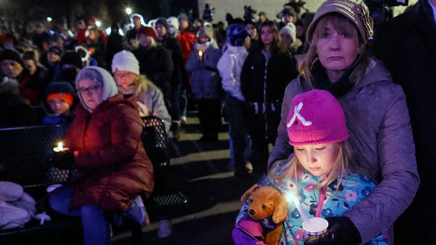 Hundreds gather for candlelight vigil Monday night in Waukesha, Wisconsin, to honor lives lost